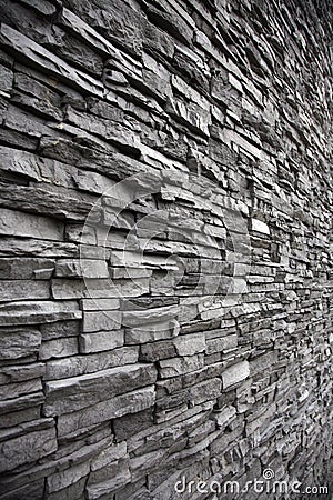 Irregular shaped stone wall with different levels Stock Photo