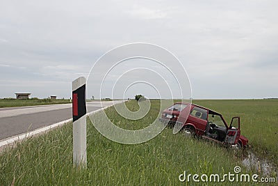 Irresponsible driving in bad weather conditions, vehicle went off road in ditch Editorial Stock Photo