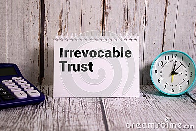 Irrevocable trust document with text on wooden background Stock Photo