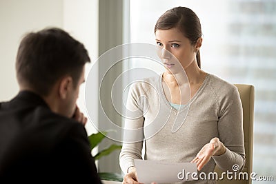 Irritated businesswoman disagree with bad contract, boss dissati Stock Photo