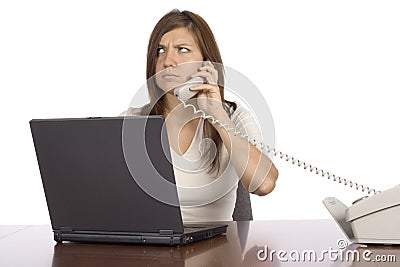 Irritated businesswoman on the phone Stock Photo