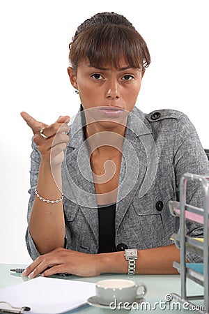 Irritated businesswoman Stock Photo