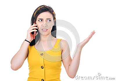 Irritated young woman holding the mobile phone, isolated on white background. Annoyed female person with smartphone. Nuisance Stock Photo