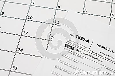 IRS Form 1095-A Health Insurance Marketplace Statement tax blank lies on empty calendar page Stock Photo