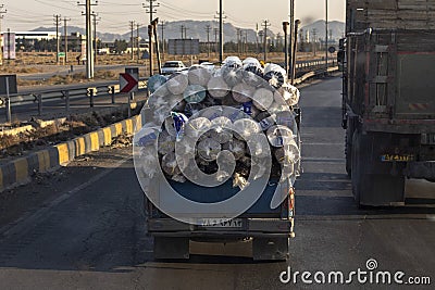 A truck carries rolls of traditional Persian rugs Editorial Stock Photo