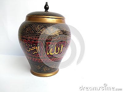 Islamic Calligraphy on a ceramic vase isolated on white background Stock Photo