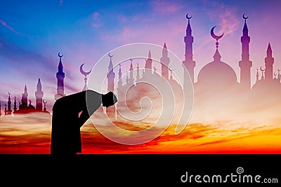 Islamic man praying Muslim Prayer in Twilight time Stock Photo