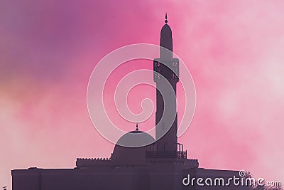 Islamic mosque in the hazy colored sky in combat and war. Conflict and religious war concepts Stock Photo