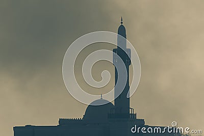 Islamic mosque in the hazy smoky hazy sky in combat and war. Conflict and religious war concepts Stock Photo