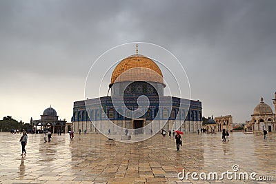 Islamic shrine Dome of the Rock with gold leaf and dark clouds on Temple Mount in Jerusalem Old City, Israel Editorial Stock Photo