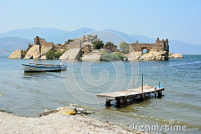 Island with ancient fortifications on Bafa lake in Mugla, Turkey Stock Photo