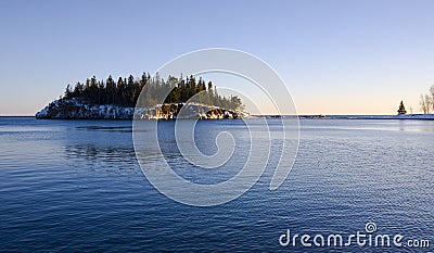 Island in Cold Blue Water Stock Photo