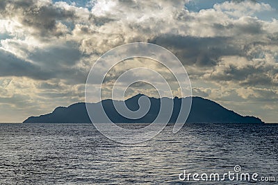 The Island of Gorgona, Italy, under a dramatic sky Stock Photo