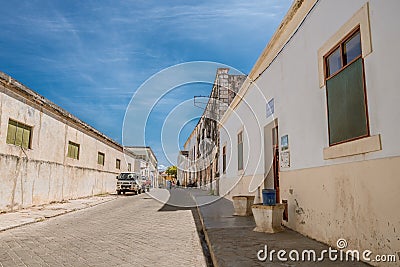 A quiet, empty street in the beach town of Ilha de Mocambique on a sunny day. Editorial Stock Photo