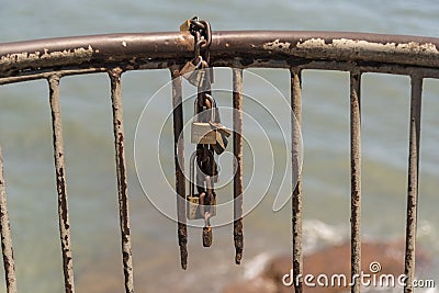 Rusting guard rail padlock and chain Corredor Artesanal De Casco Antiguo Editorial Stock Photo