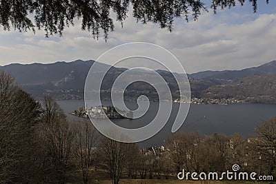 The Island of San Giulio and the city of Pella on the opposite side of Lake Orta Stock Photo