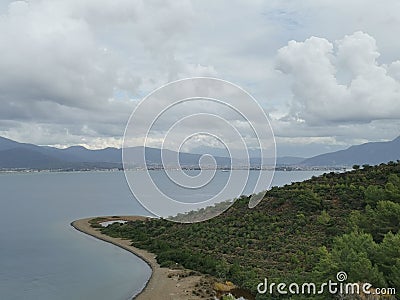 Island in the sea and cloudy sky. View of Fethiye from the Kizil Ada island. Stock Photo