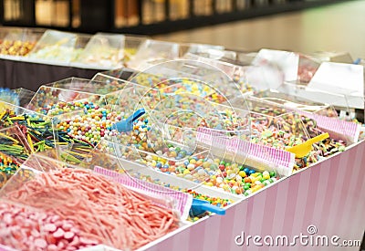 island type candy shop, market stand with boxes of colorful candy, sweets in transparent containers Stock Photo