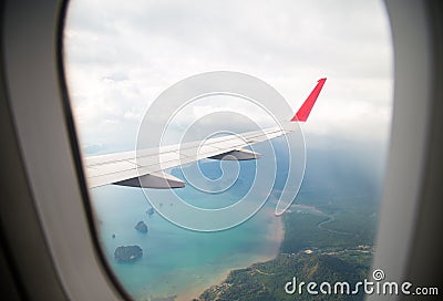 Island view through aircraft windows over the sea Stock Photo