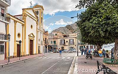 People resting in the park near the Mothers Church in the center of the Island of Women or Isola delle Femmine, province of Palerm Editorial Stock Photo