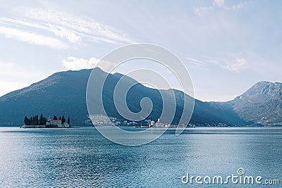 Islands of the Bay of Kotor against the backdrop of mountains and a cloudy sky. Montenegro Stock Photo