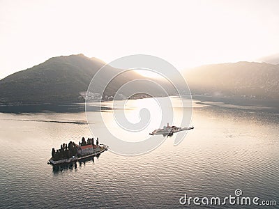 Islands of the Bay of Kotor in the rays of the setting sun. Montenegro. Drone Stock Photo