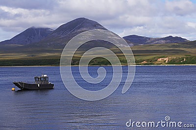 The Isle of Jura including the Paps (mountains) across the Sound of Islay, Scotland, UK Stock Photo