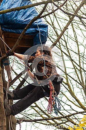 ISLINGTON, LONDON, ENGLAND- 18 November 2020: Save Our Trees protester in a treeat Dixon Clark Court Editorial Stock Photo