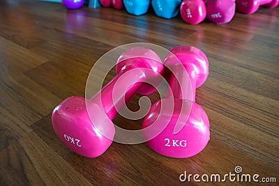 Isolate dumbbell on wooden background . Stock Photo