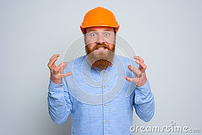 Isolated anger architect with beard and orange helmet Stock Photo