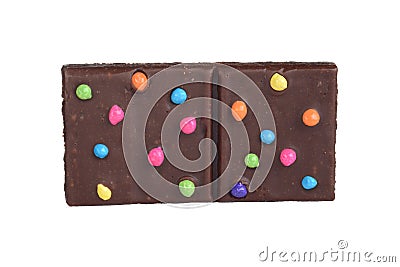 Isolated brownie square with colorful candy pieces Stock Photo