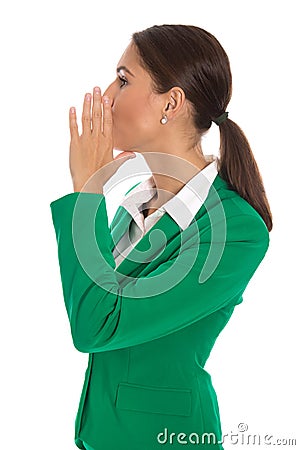 Isolated businesswoman in green blazer send message or calling u Stock Photo