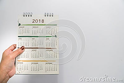 Isolated businesswoman hold 2018 calendar for meeting reminder Stock Photo