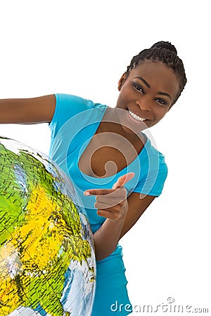 Isolated colored young woman holding a globe in her hands. Stock Photo