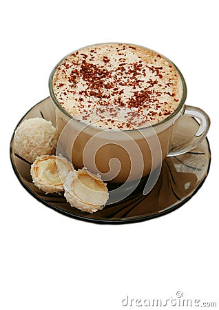 Isolated cup of capuccino and two coconut candies Stock Photo