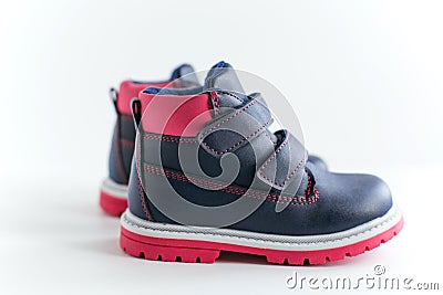 Isolated dark blue with pink children leather shoes on a white background Stock Photo