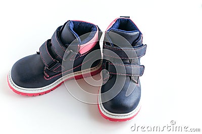 dark blue with pink children s spring and autumn leather shoes on a white background Stock Photo