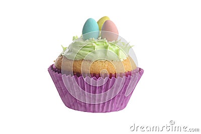 Isolated easter cupcake with green frosting and mini eggs Stock Photo