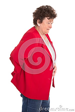 Isolated female senior in red has backache or rheumatism. Stock Photo