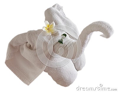 Isolated fold towel elephant with flower and green leaves Stock Photo