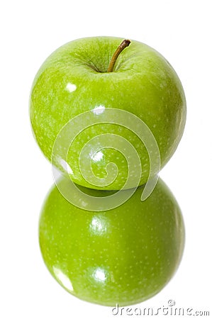 Isolated green apple in mirror Stock Photo