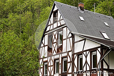 Isolated half-timbered house in the forest Moselkern, Germany Stock Photo