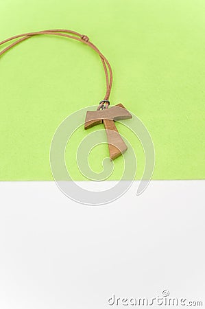 isolated hand made wooden tau cross pendant - Greek letter tau Stock Photo