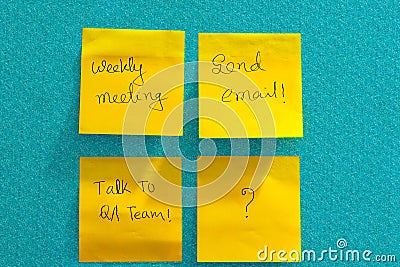  handwritten reminder notes on yellow-colored sheets of paper Stock Photo