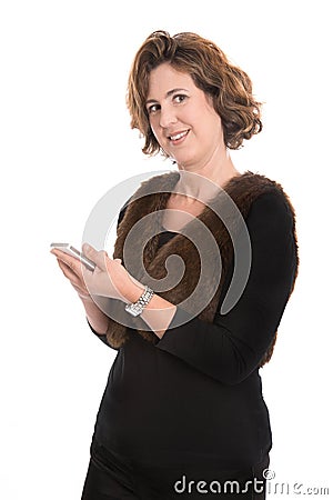 Isolated mature woman writing a message on her phone. Stock Photo