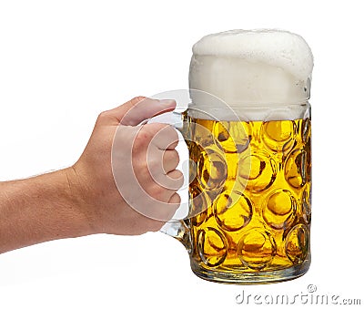 Isolated mug of beer holding in hand at Oktoberfest in Bavaria Stock Photo