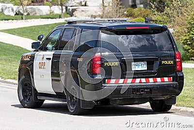 Isolated Ontario Provincial Police cruiser on a call. Editorial Stock Photo