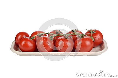 Isolated organic cherry tomatoes on the vine in cardboard tray Stock Photo