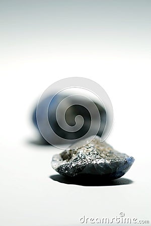 Isolated picture of broken lucky stone on white background Stock Photo