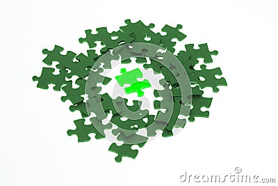 Isolated piece of green lumious jigsaw puzzle Stock Photo